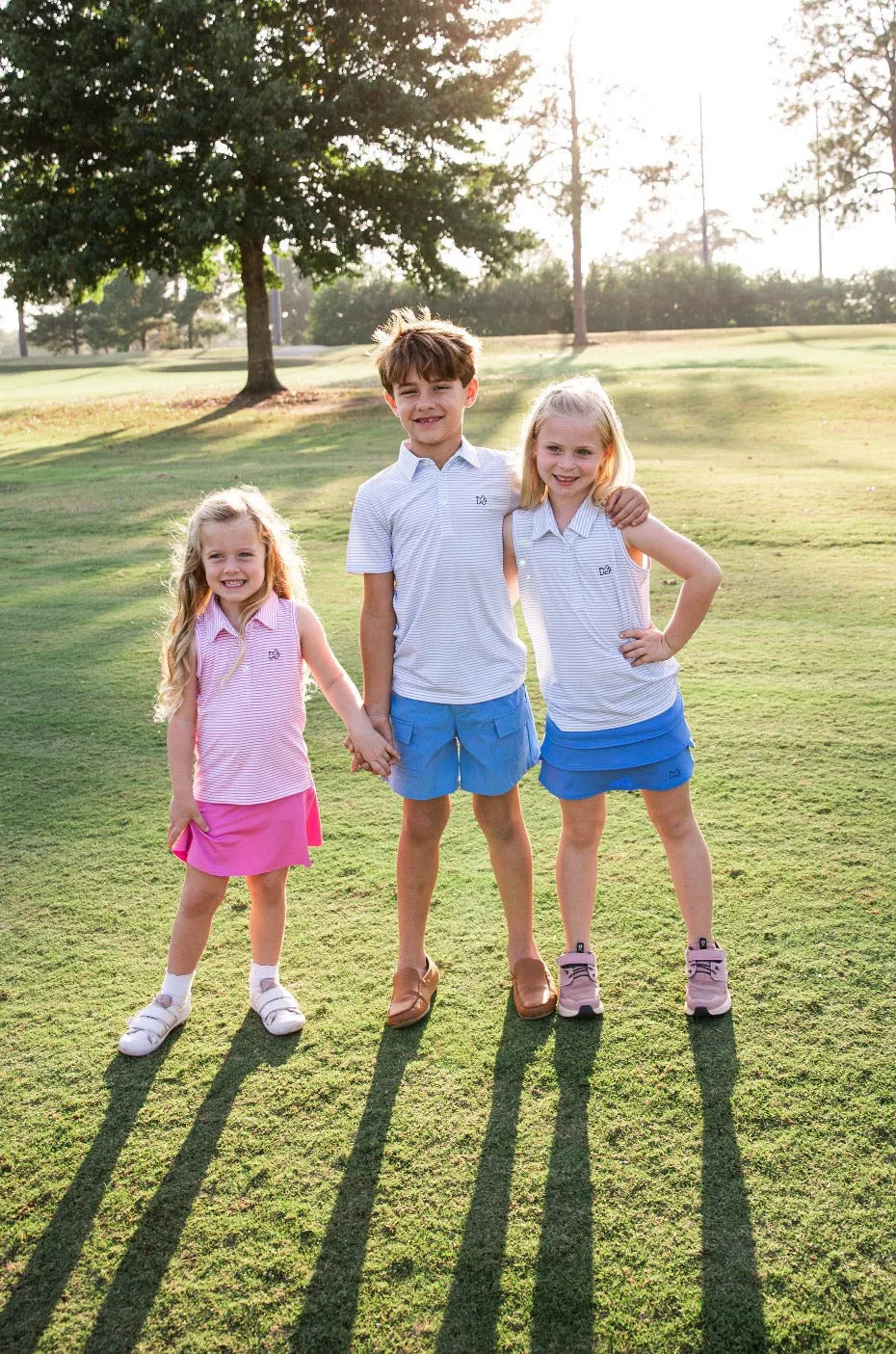 Girls Sleeveless Pro Performance Polo Shirt in Fuchsia Pink Stripe